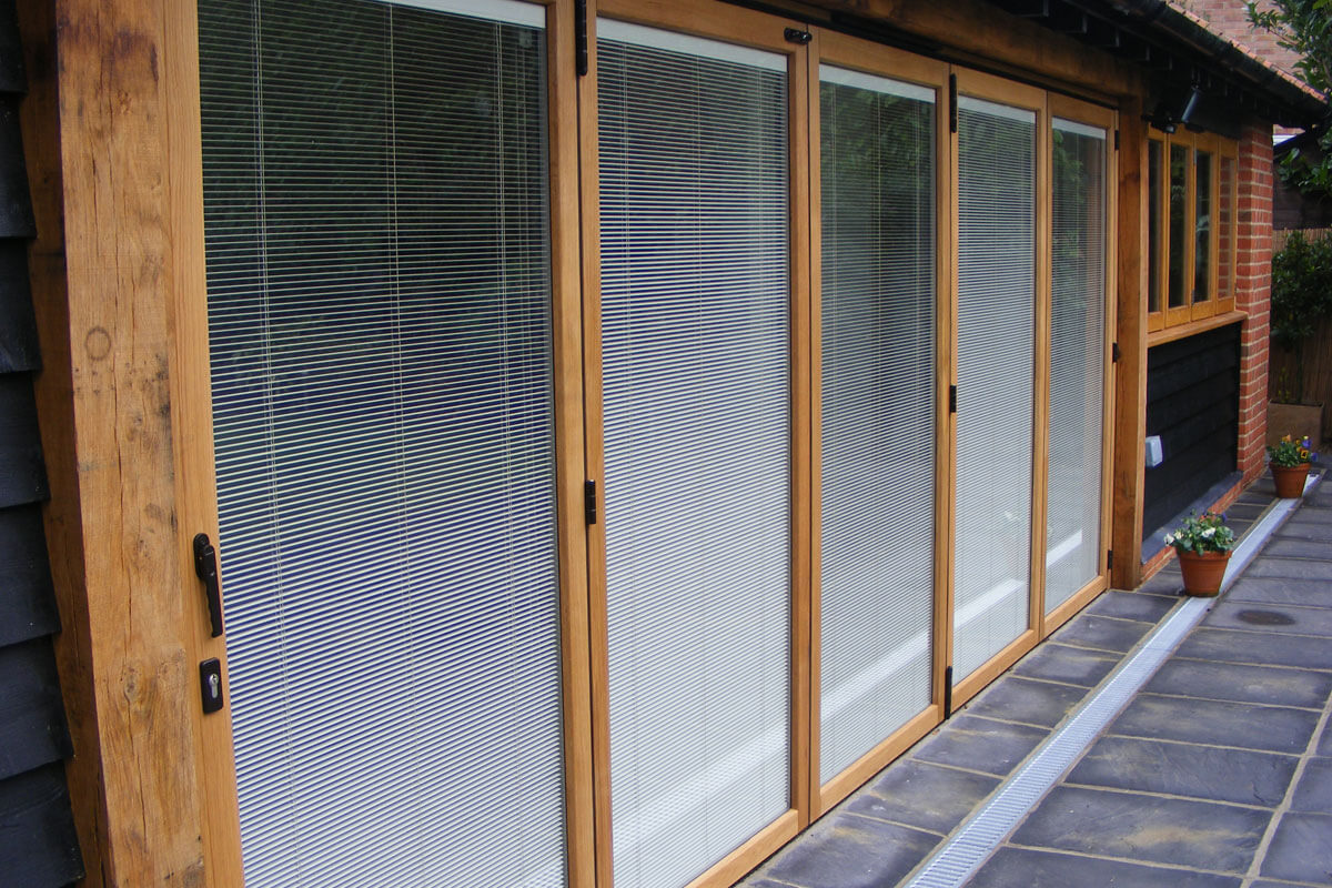An example of a Uni Blinds installation into bi-folding doors by Bosomworth Glass in Filey