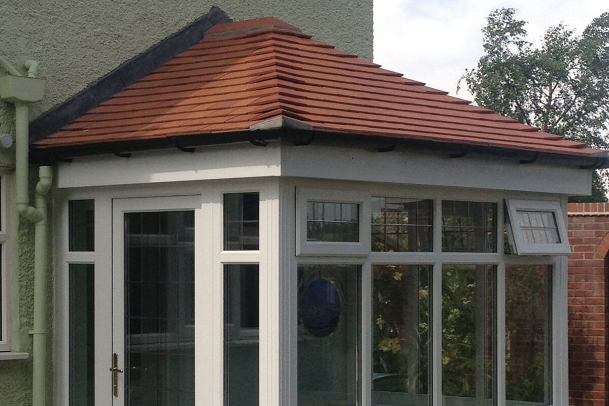 A small conservatory with a new tiled roof in Filey from Bosomworth Glass